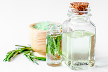 organic cosmetics with extracts of herbs rosemary on white backg
