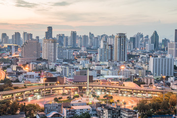 Fototapeta na wymiar Bangkok City at sunrise time, Hotel and resident area in the capital of Thailand.Top view : modern building in Business bangkok district at Bangkok city with skyline at twilight,Thailand