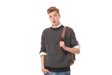 Fototapeta premium Studio portrait of handsome college boy in casual clothing with backpack