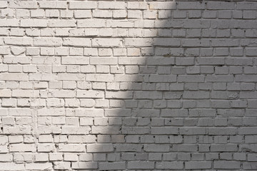 full frame of white brick wall background with shadow and sunlight