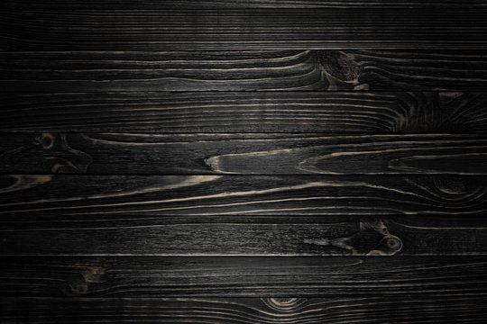 Black wood striped texture with vignette