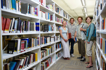 Four young students in a library