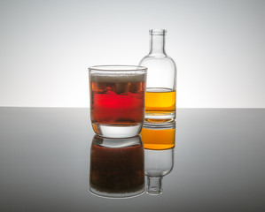 burbon whiskey on the rocks ice shapped like stars on reflective surface