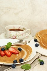 Homemade Whole wheat pancakes served with berries, selective focus