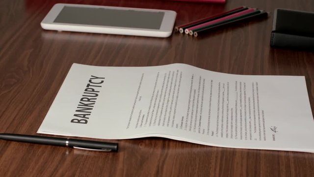 Two Businessmen Meeting For A Handshake And To Sign A Bankruptcy Documents. One Of Them Leaves A Locker For The Other To Take.
