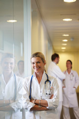 Fototapeta premium Doctor against a window, smiling