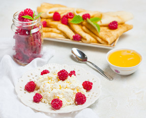 Homemade pancakes with honey, raspberries, cottage cheese with powder sugar. Flat lay, top view. copy space. eco style