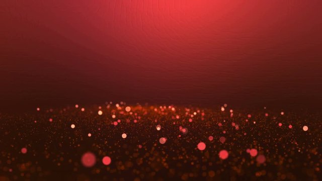 Sparkling red particles in slow motion on blurred background. Ultra High Definition 4K seamless loop video.