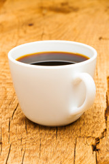 Fototapeta na wymiar Indoors shot of a cup of black coffee