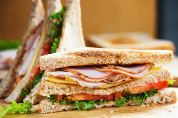 pepper ham cheese sandwich with whole wheat bread for breakfast on wooden board