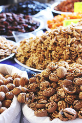 Chopped walnuts and dried fruits in bags at east bazar