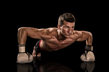 Fototapeta na wymiar Athletic bodybuilder pose in pants.