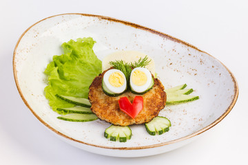 Cutlets with mashed potatoes and lettuce.