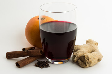 Mulled wine with ingredients, cloves, cinnamon, orange.