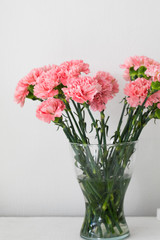 Fototapeta premium Bouquet of carnation in a glass