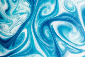 Swirl shape made with blue and white paint.
