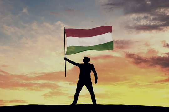 Male silhouette figure waving Hungary flag. 3D Rendering
