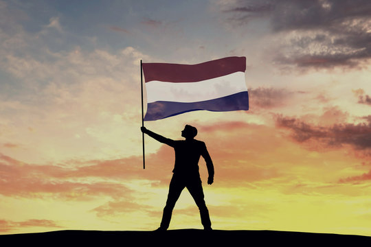 Male silhouette figure waving Netherlands flag. 3D Rendering