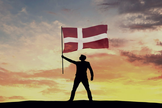 Male silhouette figure waving Denmark flag. 3D Rendering