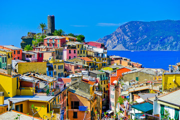 View of the colorful houses along the coastline of Cinque Terre area in Vernazza, Italy.