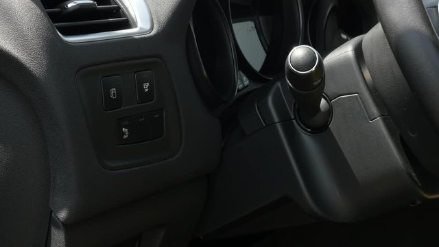 Manual sticks and interior of modern vehicle 4K 2160p 30fps UltraHD tilting footage - Dashboard details of brand new car slow tilt 3840X2160 UHD video
