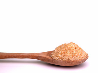 Sugar In a wooden spoon.