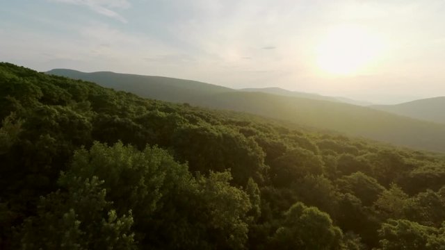 Drone Flight Up Reveals Sun and Mountains