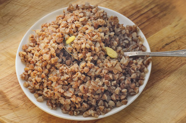 buckwheat porridge in white ceramic plate
