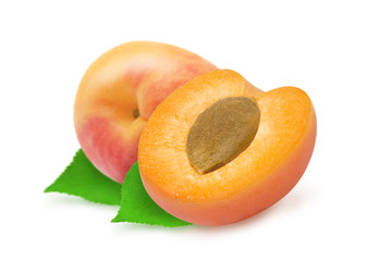 Fresh whole apricot and half with stone and green leaves isolated on white background. Design element for product label, catalog print, web use.