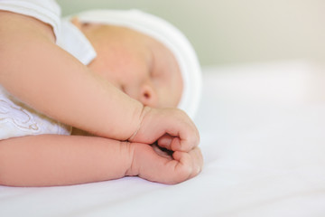 little hand of sleeping baby newborn close up