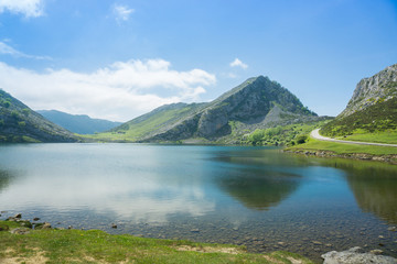Naklejka na ściany i meble Beautiful nature of Spain: Covadonga mountain lakes in summer sunny day with blue sky and clouds