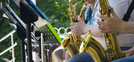 Street musician plays his saxophone