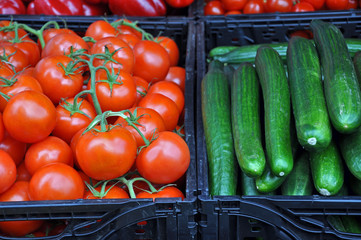 Fresh tomatoes and cucumbers at farmers market