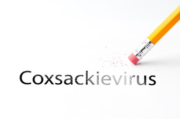 Closeup of pencil eraser and black coxsackievirus text. Coxsackievirus. Hand foot and mouth...