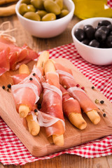 Grissini breadsticks with ham. 