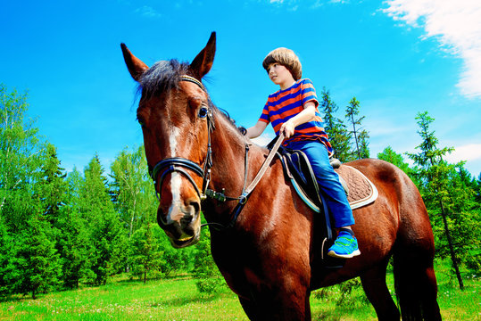 Kid Is Riding A Horse