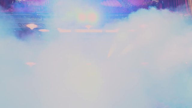 Motion camera through smoke with theater amphitheatres in the background