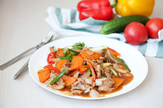 Hot salad with carrot, beef and pepper. Asian cuisine