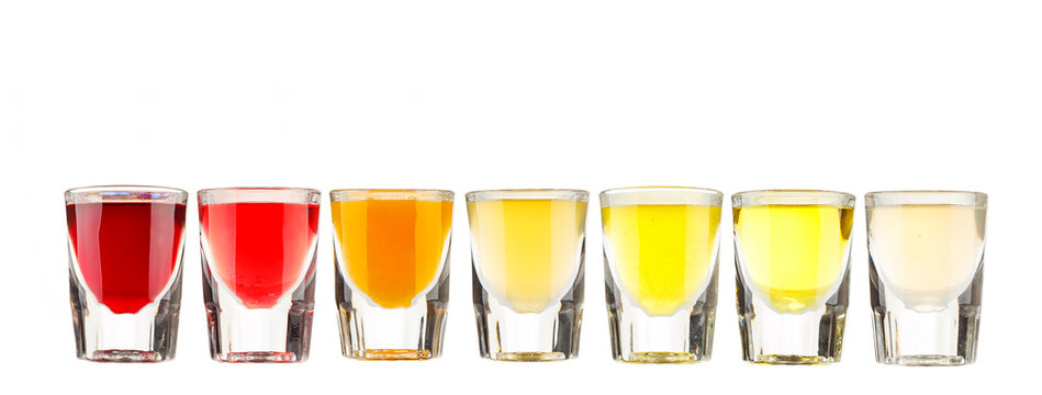 Various cocktails and alcohol on white background.