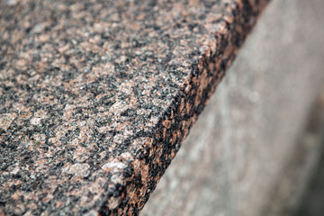 Facing material from a granite monument