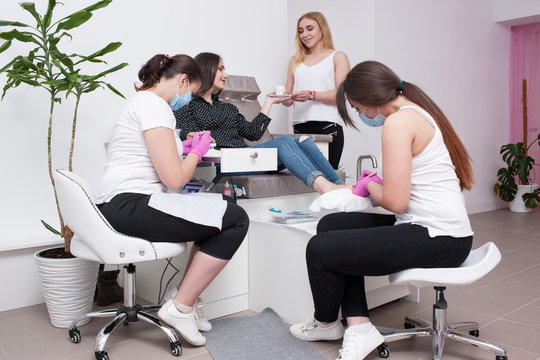 Conjunction gel polish manicure and pedicure. Professional body care service for beauty and health in salon.