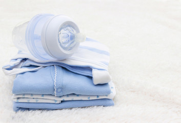 Baby clothes for newborn and pacifier , In blue colors. © magic_rainbow