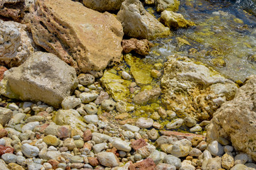 Steep, sharp, stone beaches on the Black Sea coast, in the vicinity of the city of Sevastopol of the Republic of Crimea, 2017