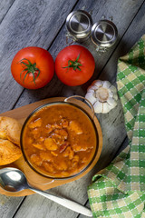 Stewed beans in tomato sauce served in bowls.