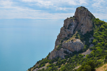Fototapeta na wymiar Steep, sharp, stone beaches on the Black Sea coast, in the vicinity of the city of Sevastopol of the Republic of Crimea, 2017