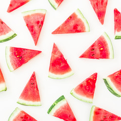 Slices of watermelon on white background. Flat lay. Top view. Summer pattern