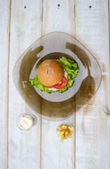 Hamburger with fresh lettuce and eggs. French fry