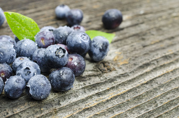 Fresh blueberries on old wood table
