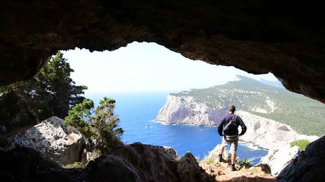 Man in Vasi rotti cave. Sardinia, Italy