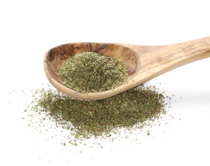 Dry marjoram in wooden spoon isolated on white background